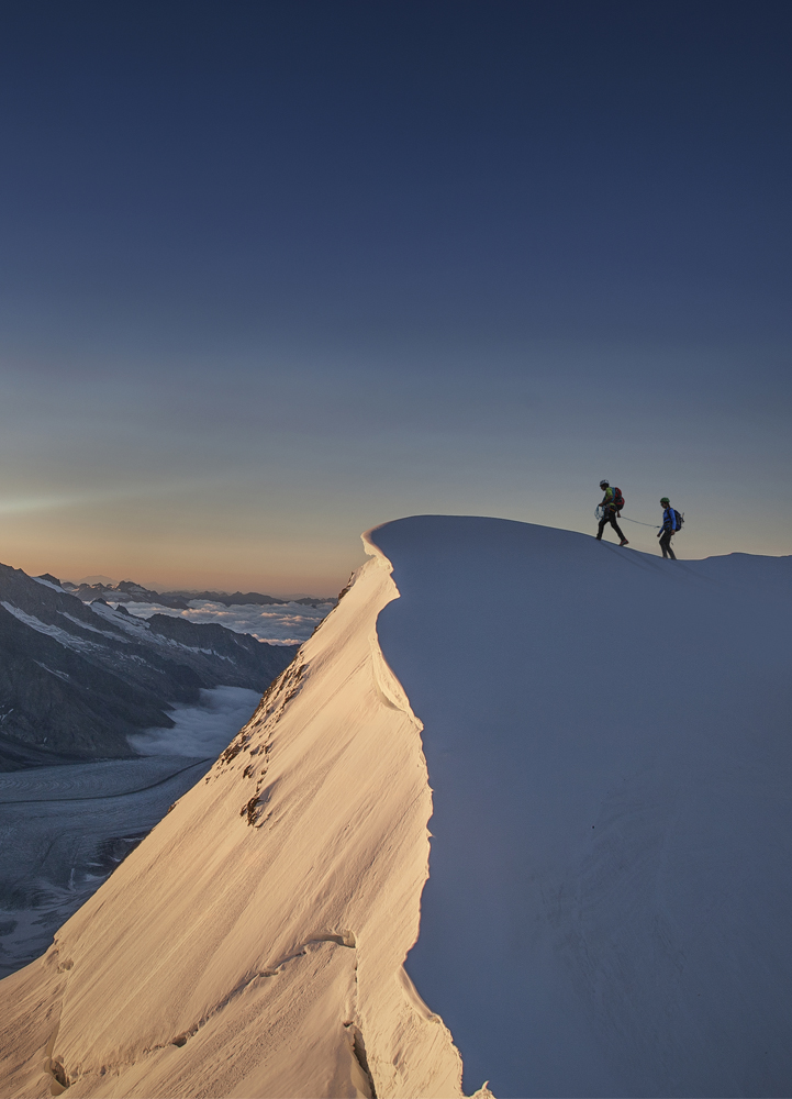 Two people on a mountaintop